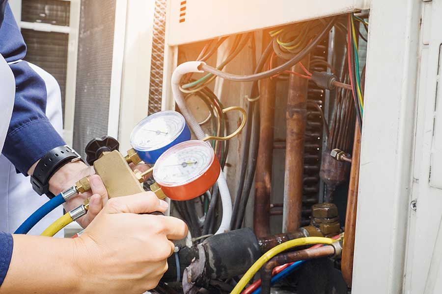 Technician repairing AC unit