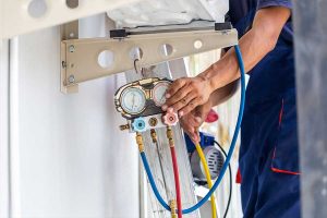 Technician performing ac repair